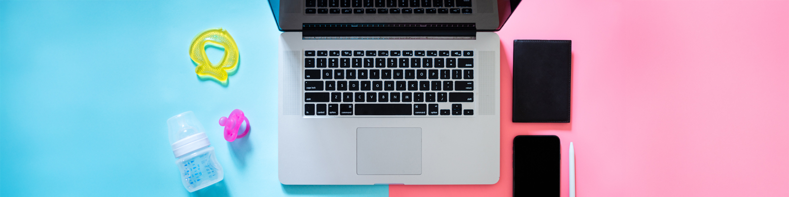Work laptop next to baby items and work items
