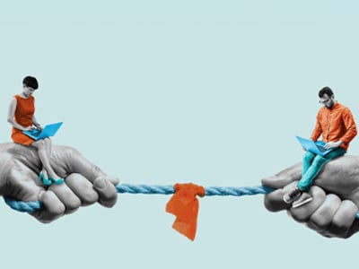 Two people sitting on hands connected by rope